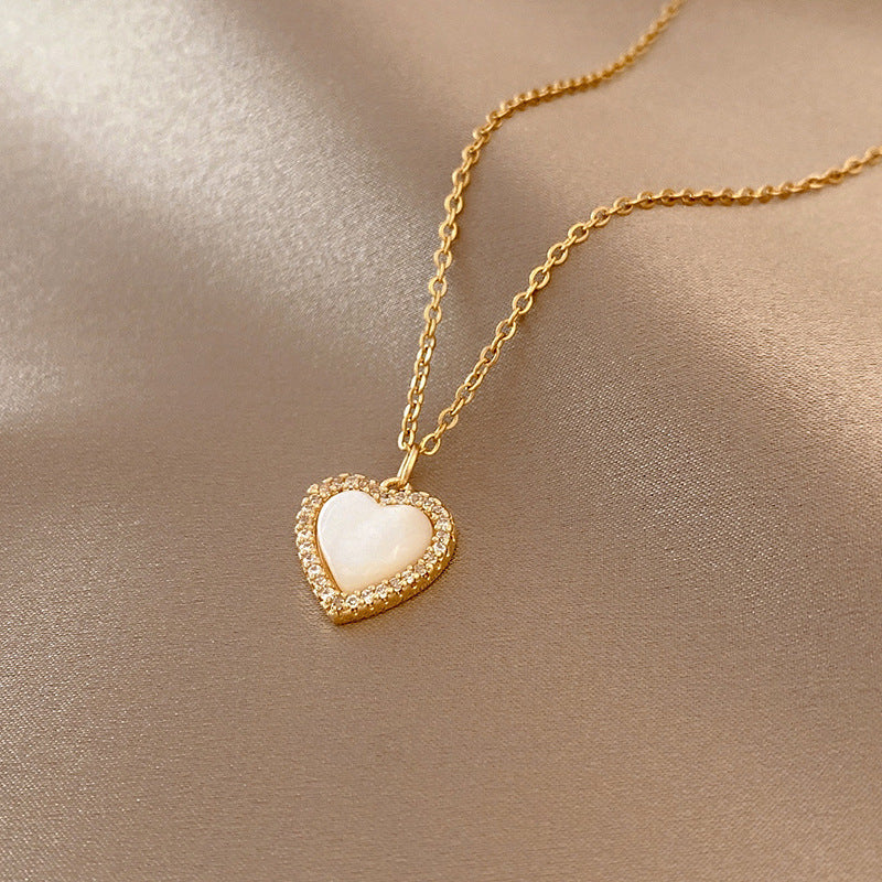 TIDEA Amour Pendant featuring a gold-toned heart charm with a white shell inlay on a delicate chain